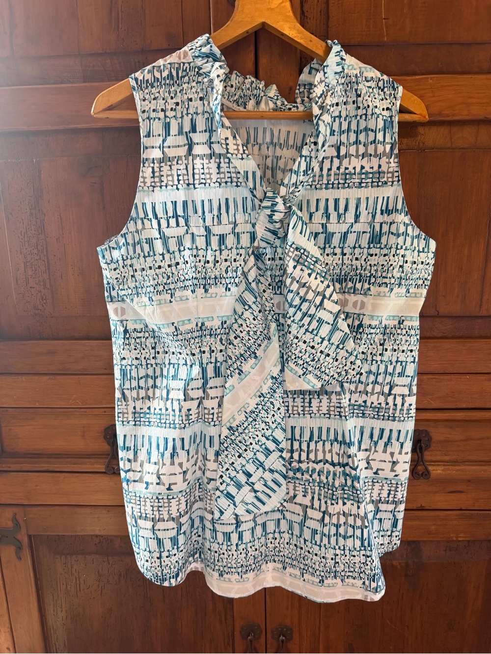 Sleeveless Tie-Neck Blouse in White and Teal Print
